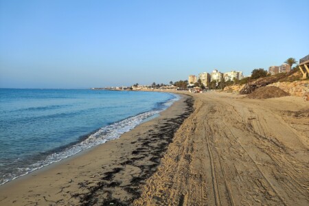 Playa de La Glea beach in Campoamor with golden sand and calm blue sea