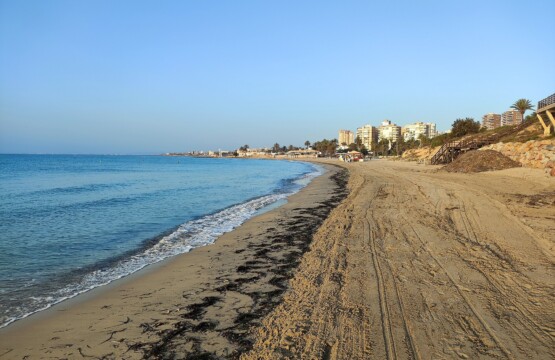 Playa de La Glea beach in Campoamor with golden sand and calm blue sea
